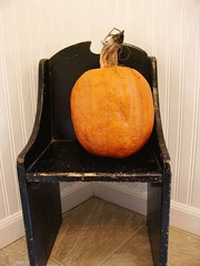 Black vintage chair with pumpkin