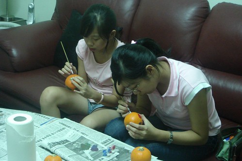 Karen and Christine painting their pumpkins