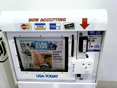 Newspaper machine with credit machine