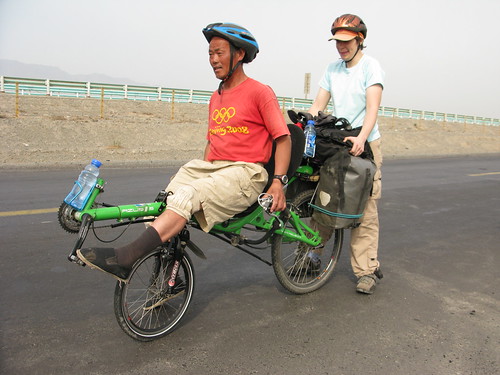 Fellow cycle tourists try out Marija's recumbent bike near Dabancheng, Xinjiang Province, China