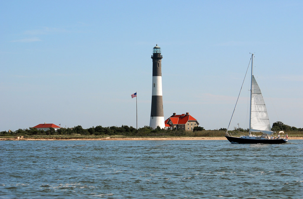 lighthouse and sail
