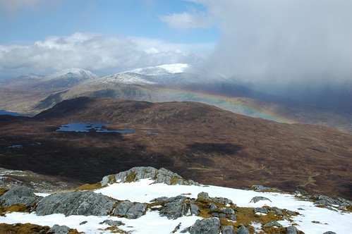 Another heavy snow shower passes with rainbow in tow