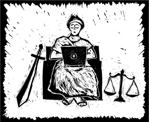 lady justice with laptop