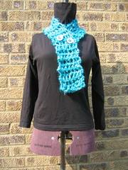 Crocheted scarf with buttons