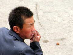 Man on street in Erbou, Qinghai Province, China
