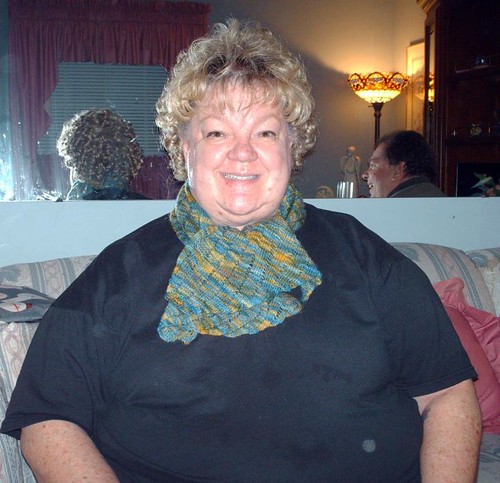 Mom wearing handpainted lace knitted clapotis scarf