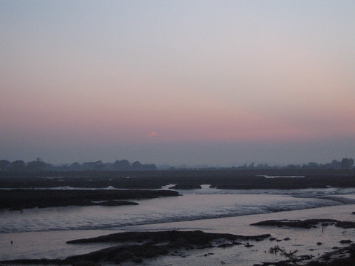 Sunset over the Backwaters at low tide, from the dyke around Naze Marine Holiday Park, Walton on the Naze