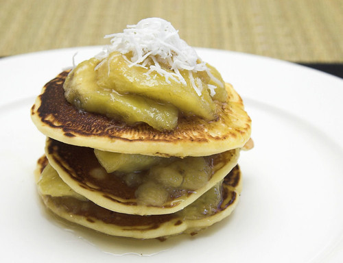 Coconut pancakes with bananas in palm sugar syrup