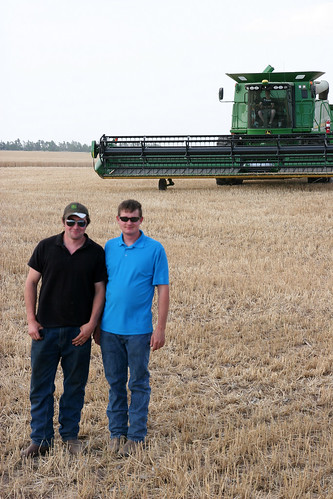 James and Leon take time for a photo op while Rolly parks his combine