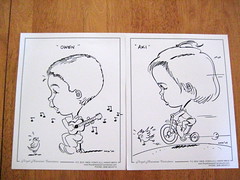 Caricatures of Owen playing the ukelele and Aki riding the tricycle