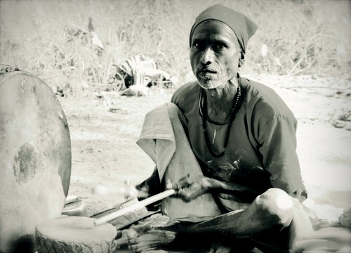 Nepalese Holy Man Playing A Drum