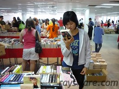 My sis looking at one of the books on sale there