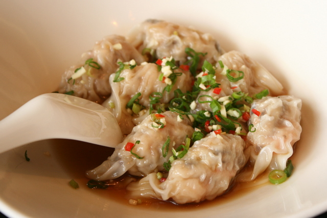 Poached Beijing dumplings stuffed with chicken and prawns in chili vinegar sauce (S$4.20 for 3 pieces)