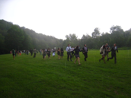 the wedding attendees running for cover