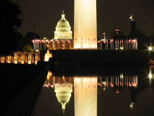 US Capitol Building, National World War II Memorial and Washington Monument over Lincoln Reflecting Pool at Night.