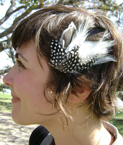 For her reception, Alli swapped her simple hairstyle for something with a. Feather clip on cute short sassy hairstyle.