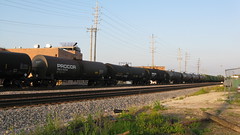 Tank cars in tow on a slow moving westbound transfer train. Franklin Park Illinois. Thursday, June 18th 2009.