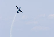 redbull air race flying over the bridge.