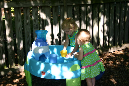 Girls playing with their water table