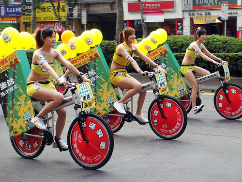 Girls riding Montague bikes during a parade.