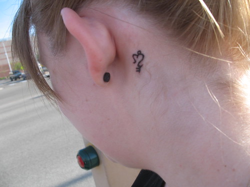 my hidden tattoo. the key to my heart is hidden behind my ear.