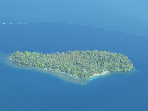 Island and boat in Madang Province