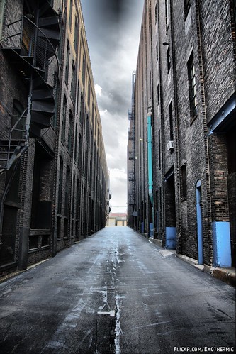 Dark brick warehouse alleyway