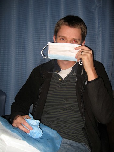 (For the record, Chris is holding this surgical mask upside down...)