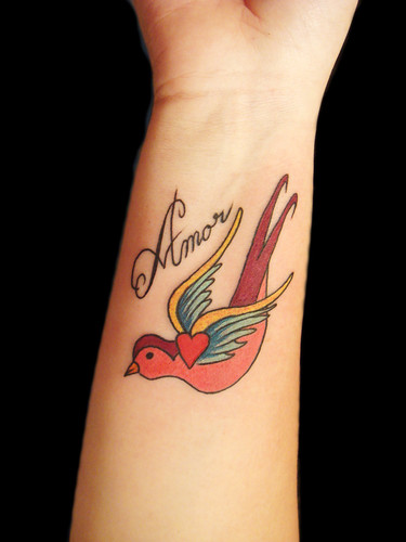 amore tattoo designs. Swallow and amor custom design