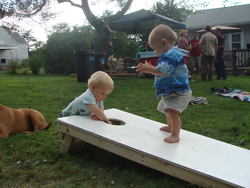 Laz and Silas playing cornhole