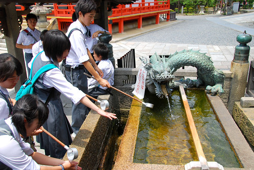 schoolkids washing before entering kiyomizudera, kyoto