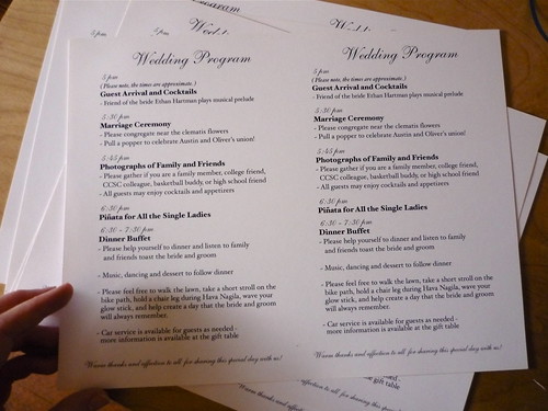 Wedding programs waiting to be cut Printed Pablo Neruda poem read in