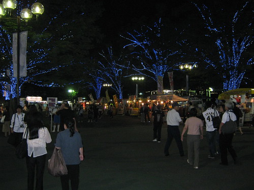 The area just outside the stadium at night.