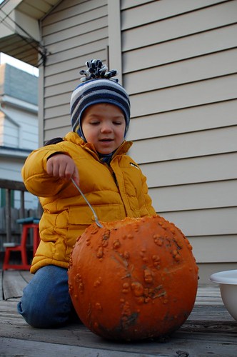 Harrison scooping out his pumpkin