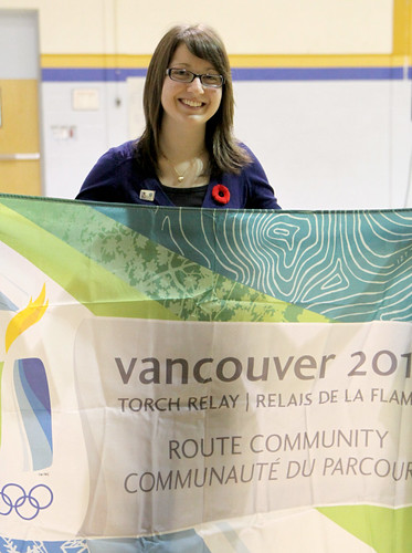 Michelle Arsenault hold a 2010 Torch Relay Flag. Michelle was selected as an Honorary Torch Bearer for the Dryden leg of the Olympic Torch Relay.