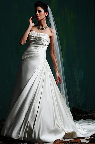 Wedding gown with crystal accents and beads.