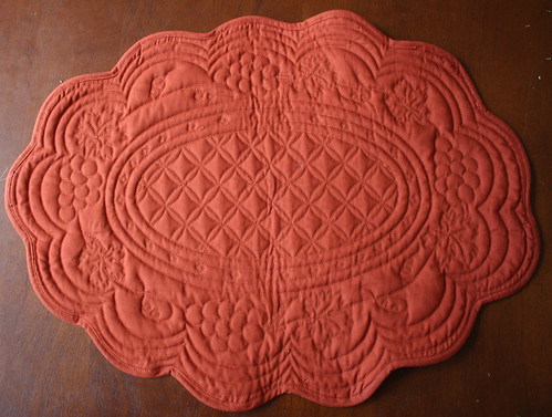 An oval quilted <span class=