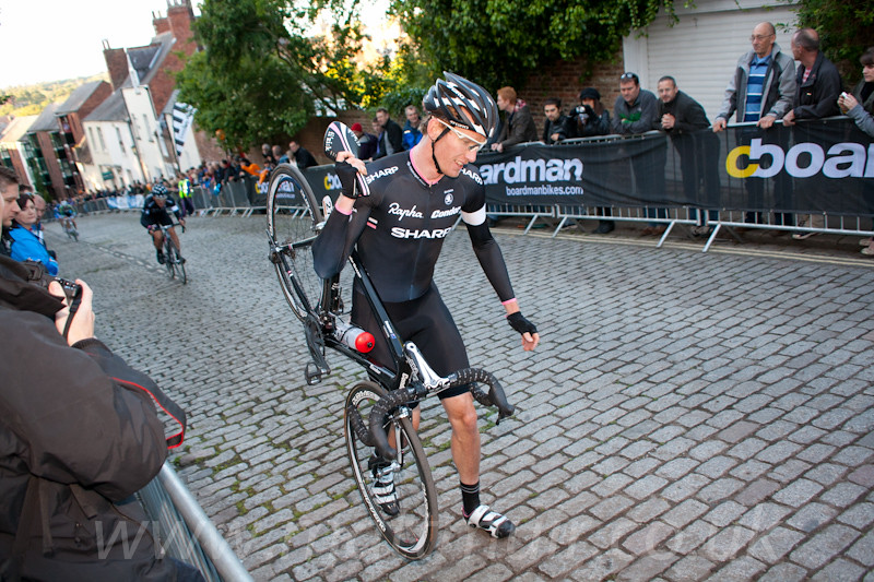 Zak Dempster walks up the long, steep cobbled climb for the 2nd time in the space of 10 minutes
