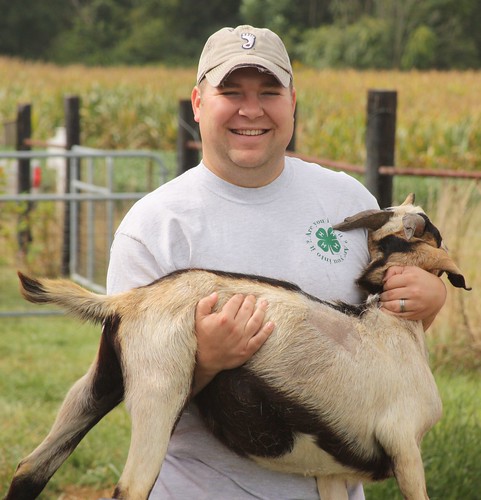 David Gordon carries a goat