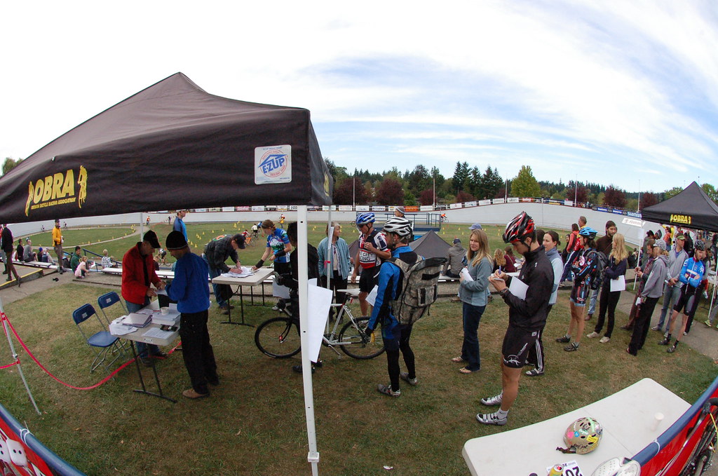 Cross racers lined up at the registration tent to get signed in and numbers for the race