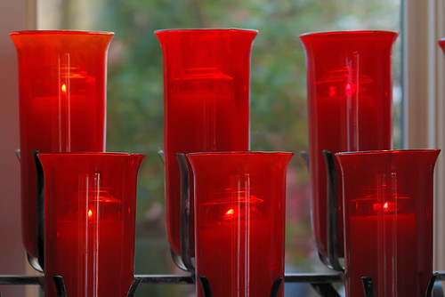 Red votive lamps, at Saint Peter Roman Catholic Church, in Saint Charles, Missouri, USA
