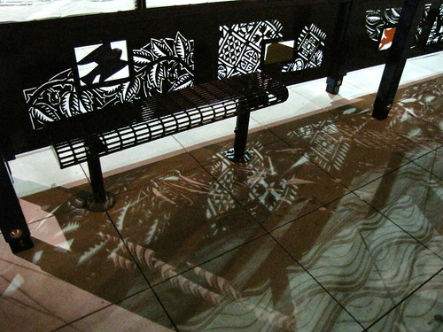 The new bus stops in front of the light rail station feature cut metal artwork. Photo by Wendi.