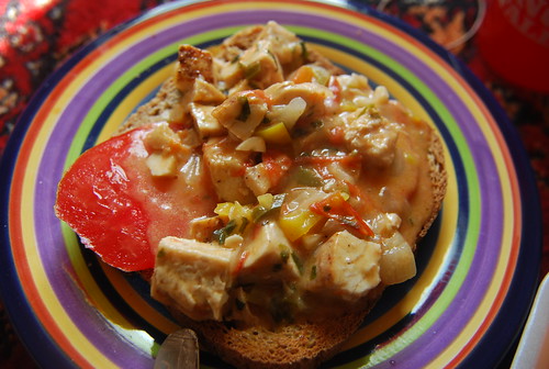 Leftover spicy cheese sauce with chicken on toast with tomato
