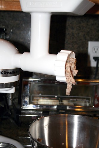 Pig's feet coming out the meat grinder