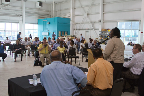 U.S. Department of Agriculture Mississippi Rural Development State Director Trina N. George addresses the gathered farmers during an outreach event at Tunica Airport in Mississippi on Thursday, May 19, 2011. Hosting the event was Congressman Bennie Thompson (left); also there to support the farmers were Under Secretary for Rural Development Dallas Tonsager (second from right); Acting Under Secretary Farm and Foreign Agriculture Service Michael Scuse (right); and other government officials that were available to answer questions and assist people in getting help is available to them. USDA Photo by Lance Cheung.