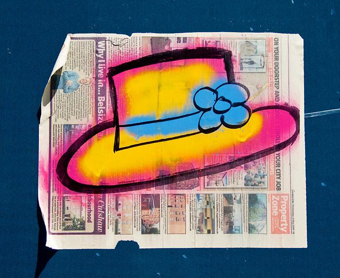graffiti: summer hat, pink & yellow with a blue ribbon & flower