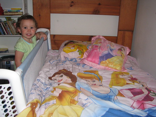 Checking out her new Princess bedding