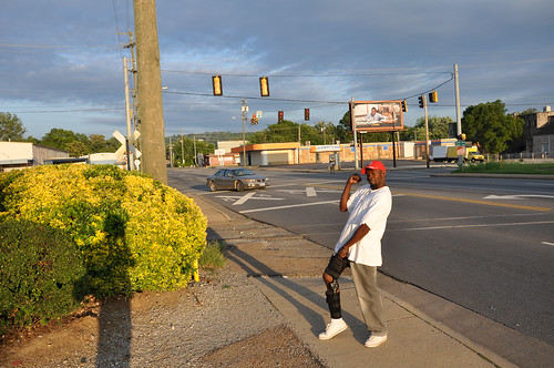 A man shows off his leg brace as he walks over to the gas station on Main Street in Chattanooga, Tennessee.