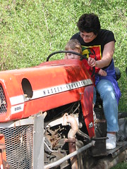 Grandma R and Gavin ride a tractor