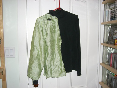 Green half-shirt over black turtleneck